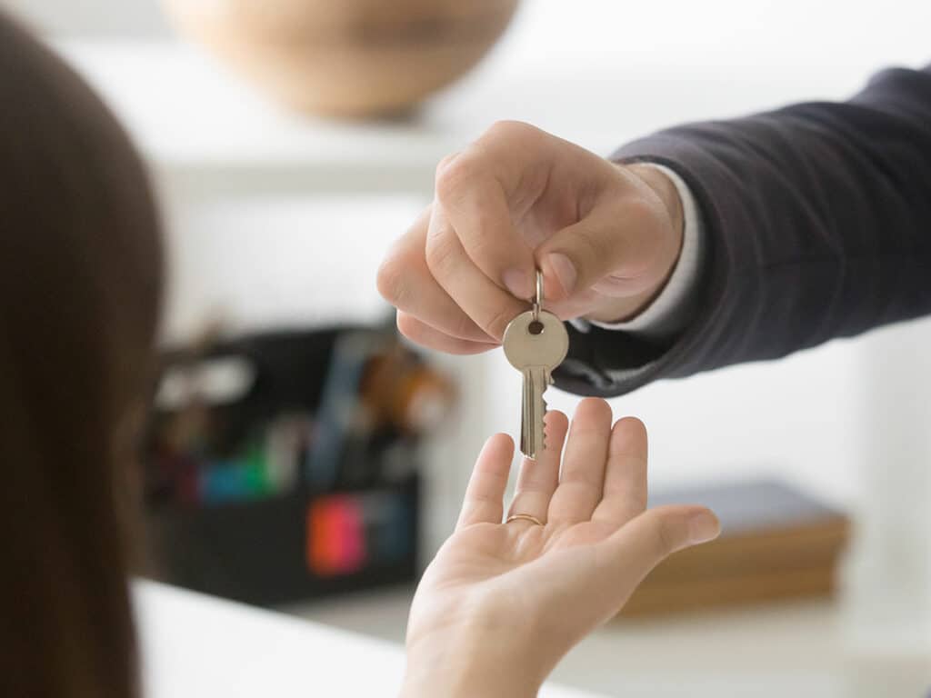 keys being handed over after signing of lease