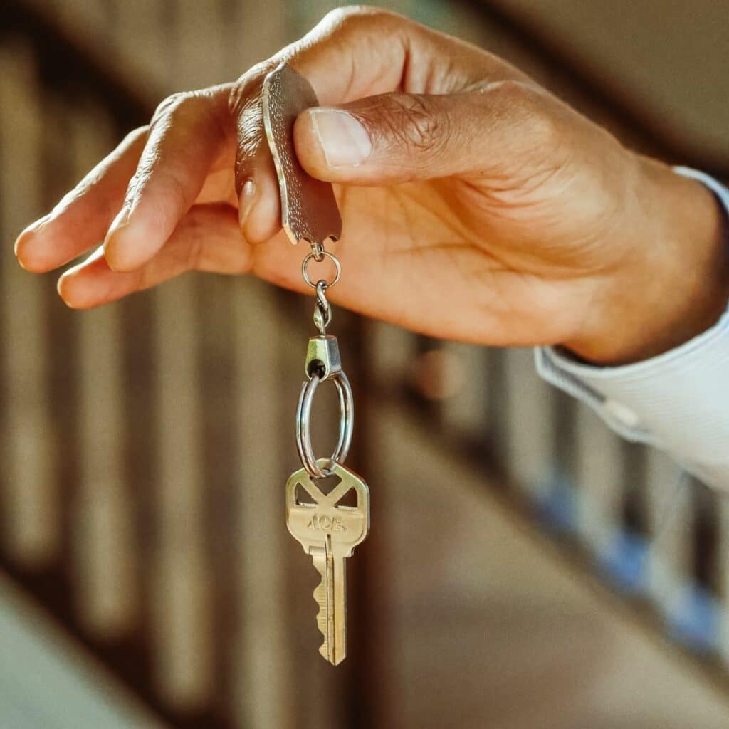 img of a hand holing a key