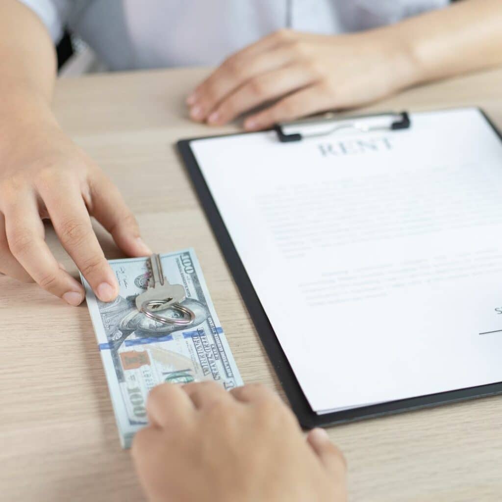 img of someone paying rent